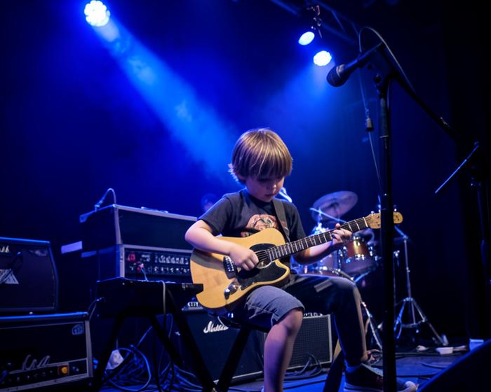 A child playing an instrument